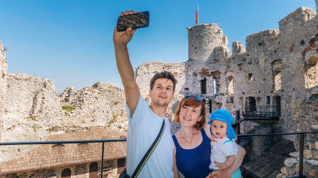 OGRODZIENIEC, POLAND - SEP 03, 2016 Family makes selfie in natureのeditorial素材