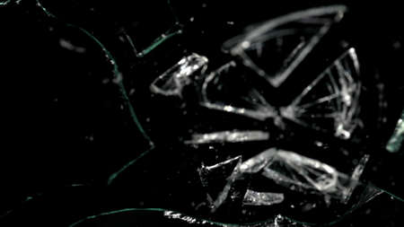 Broken mirror shattered in many pieces.