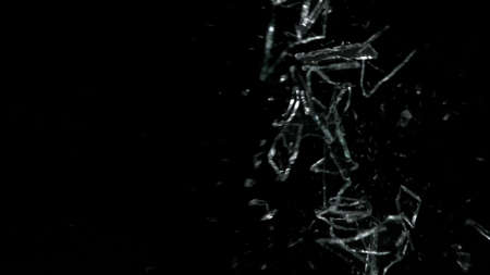 Broken mirror shattered in many pieces.