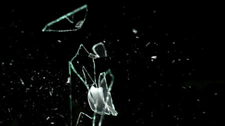 Broken mirror shattered in many pieces.