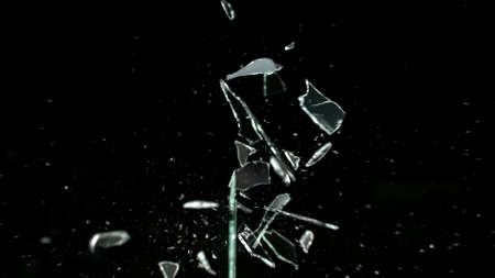 Broken mirror shattered in many pieces.