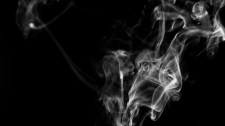 cigarette smoke isolated on dark background.