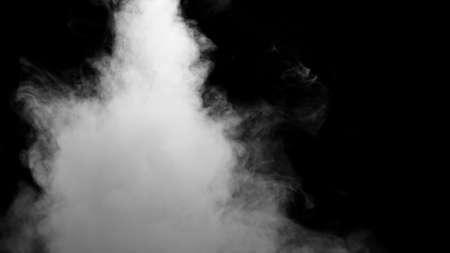 White water vapour on a black background.の写真素材