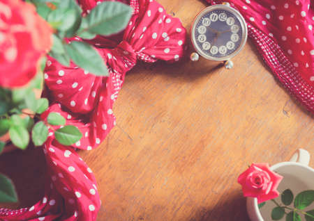 Red roses on rustic wooden table. Romantic floral frame background. Valentines day conceptの写真素材
