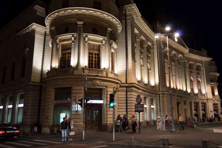 Bucharest, ROMANIA - June 27, 2015: Night scene of people strolling near the Central University Library of Bucharest, Romania. BUCHAREST -June 27, 2015のeditorial素材