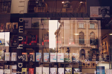 Bucharest, ROMANIA - June 27, 2015:  Display of books in Humanitas book store with the reflextion of the Museum of Art in the window. BUCHAREST -June 27, 2015のeditorial素材