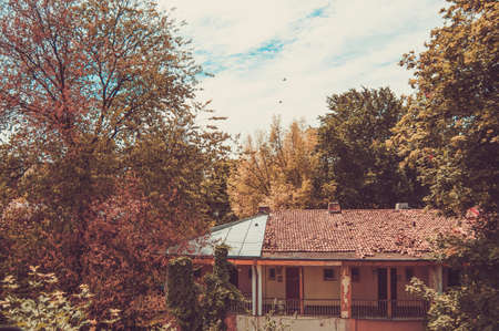 Old house in warm autumn colors. Filtered imageの写真素材