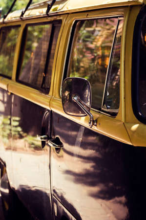 Closeup of a yellow retro beach van - vertical
