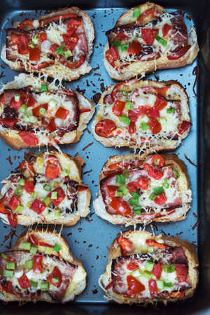 Tomato and bacon Bruschetta, Italian finger food, in a trayの写真素材