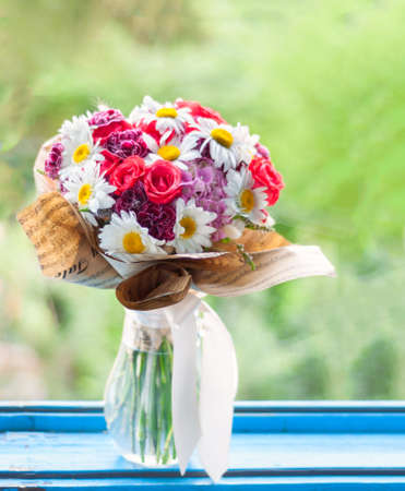 Elegant bouquet made of daisies, roses, hydrangea and mint.の写真素材