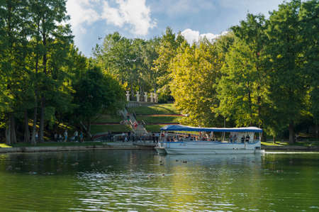 Bucharest, ROMANIA - August 14 2016: People taking a tour of the park on a boat or strolling through IOR park. BUCHAREST -August 14 2016のeditorial素材