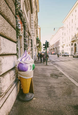 Big purple and green ice cream cone on the streets of Romeのeditorial素材