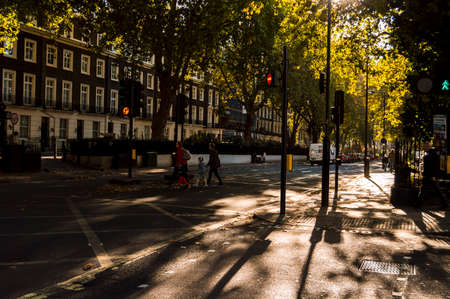 People of London walking in the sunset light on the street near Paddington station.のeditorial素材