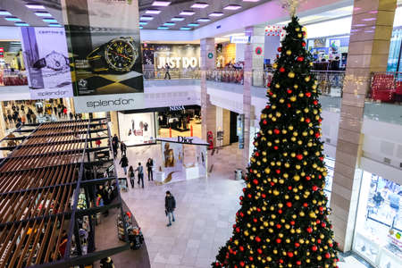 Interior of AFI Cotroceni Shopping Mall, Bucharest during holiday season. Big Christmas tree seen from aboveのeditorial素材
