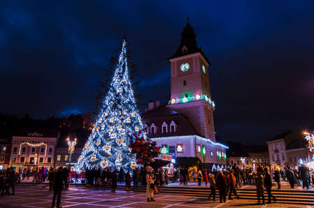 Council Square and Christmas Tree in the old city center of Brasov on a winter night.のeditorial素材