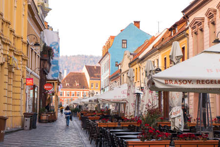 Beautiful buildings and empty terraces in the historic center of Brasov