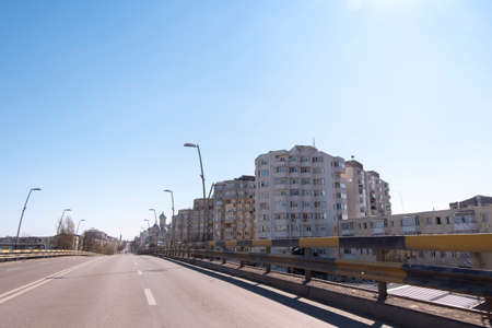Marasesti street in Bacau on a sunny day. View of local buildings and the orthodox church of the...
