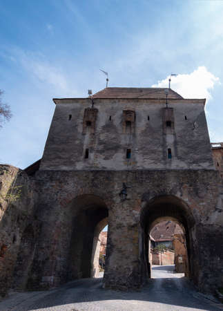 Alley leading to the Tailors Tower, a gate built in the 14th century to defend the entrance to the citadel. Closeup view on a sunny day in springの写真素材