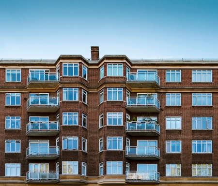 London, England - October 25, 2017: Red brick building in London againt a clear blue sky. LONDON, October 25 2017のeditorial素材