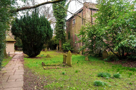 Ancient funeral stones in the yard of St Dunstans Church, in Cranford Park.のeditorial素材