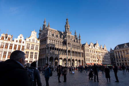 Tourists visiting the main square Grand Place on a sunny autumn dayのeditorial素材
