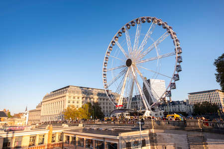 Ferris Wheel in Place Poelaert, near the Palace of Justice, in Brussels, in sunset light.のeditorial素材