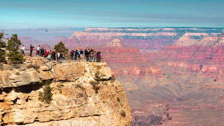 Group of tourists seen from a distance at the Grand Canyon