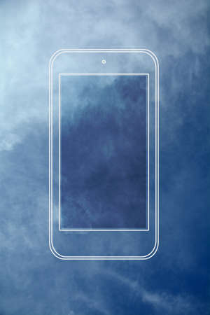 Smartphone with blue sky backgroundの写真素材