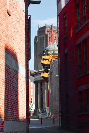 Alleyway view of liverpool cathedral, Chinatown Gate &  Great George Street Congregational Churchの写真素材