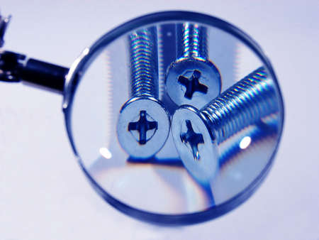 screws under a magnifier in  blue color                               の写真素材