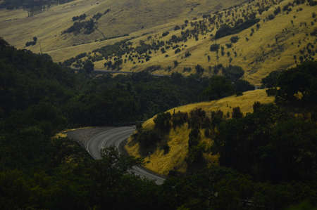 a windy country road daytime.