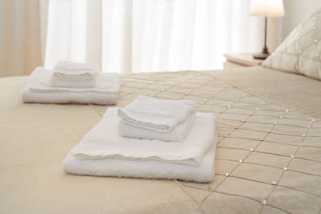 Bed with fresh towelsの写真素材