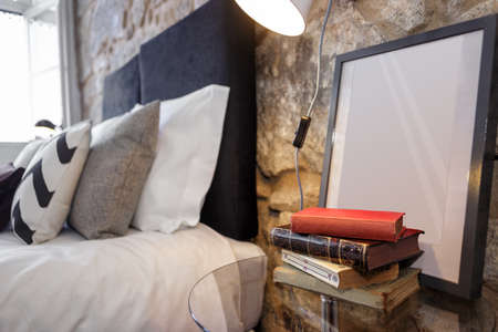 Glass Nightstand With Old Books