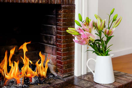 Flower Vase by the Fireplaceの写真素材