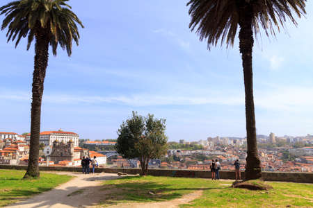 September 5, 2012: Tourists admiring the view from on of the best sightseeing spots in Porto....