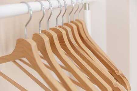 Close-up of stylish wooden clothes hangerの写真素材