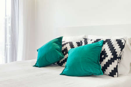 Fresh and clean pillows on a bedの写真素材