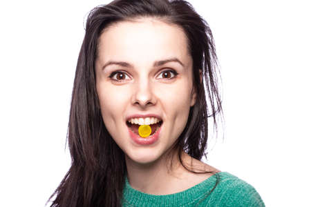 beautiful young girl holding in her mouth a lollipop against cough