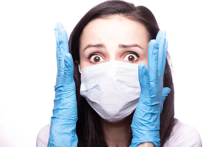 girl in a medical mask and gloves