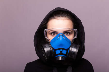 beautiful young girl in a respiratory maskの写真素材