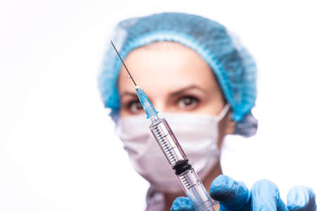 beautiful young girl holding a syringeの写真素材