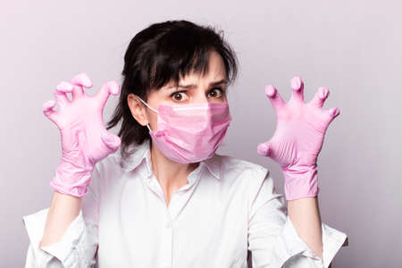 girl in a white shirt, pink medical mask and gloves