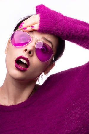 woman dressed in purple clothes, single color, closeup portraitの写真素材