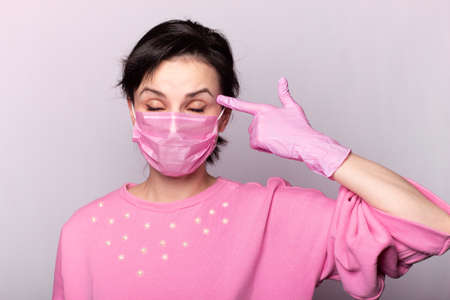 woman in a pink medical mask and gloves, virus