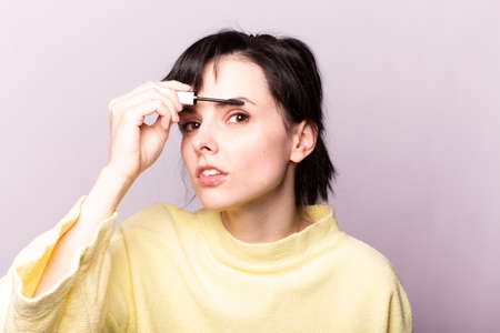 beautiful young girl close up portrait paints eyelashesの写真素材