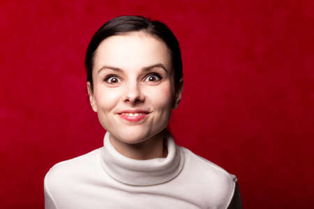 portrait of a girl on a red background