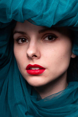 Young woman with red lipstick on her lipsの写真素材