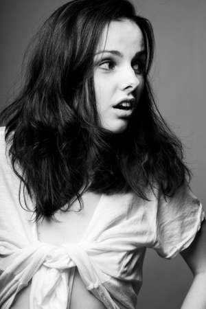 beautiful girl in a white T-shirt, black and white photoの写真素材