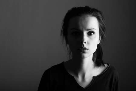 brunette with dark eyes, woman, clean skin, black and white portraitの写真素材