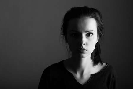 brunette with dark eyes, woman, clean skin, black and white portraitの写真素材